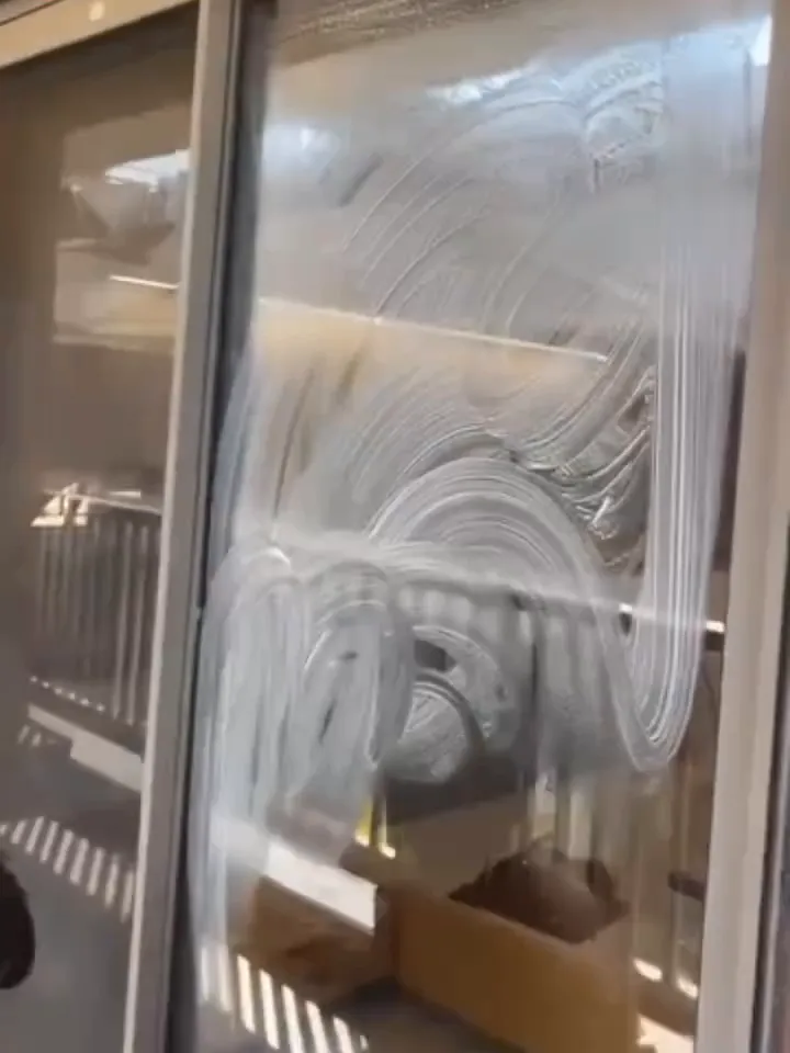 Glass doors being cleaned with foam