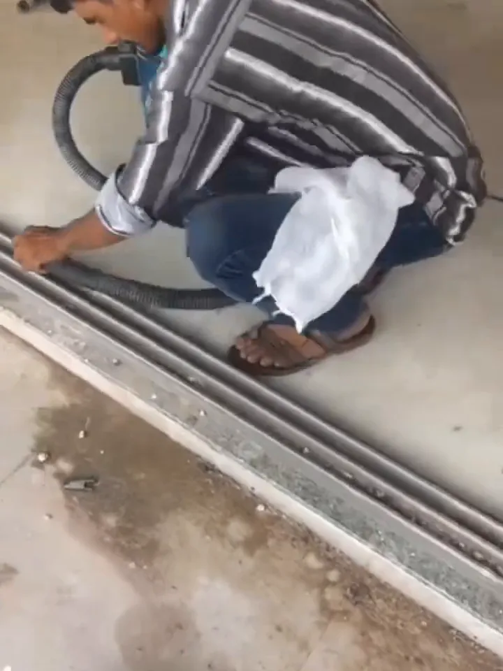 Cleaning dust from sliding door tracks in a new building